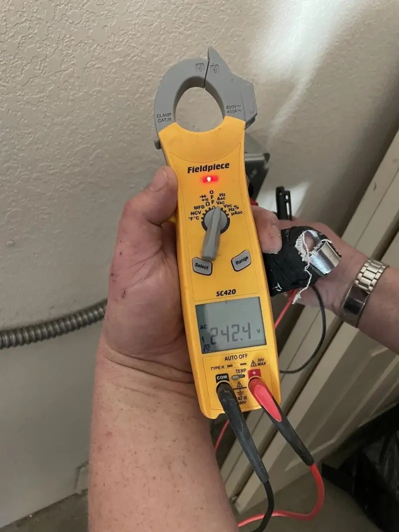 Voltage testing with clamp meter during Electrical Installation Services in Pine Ridge